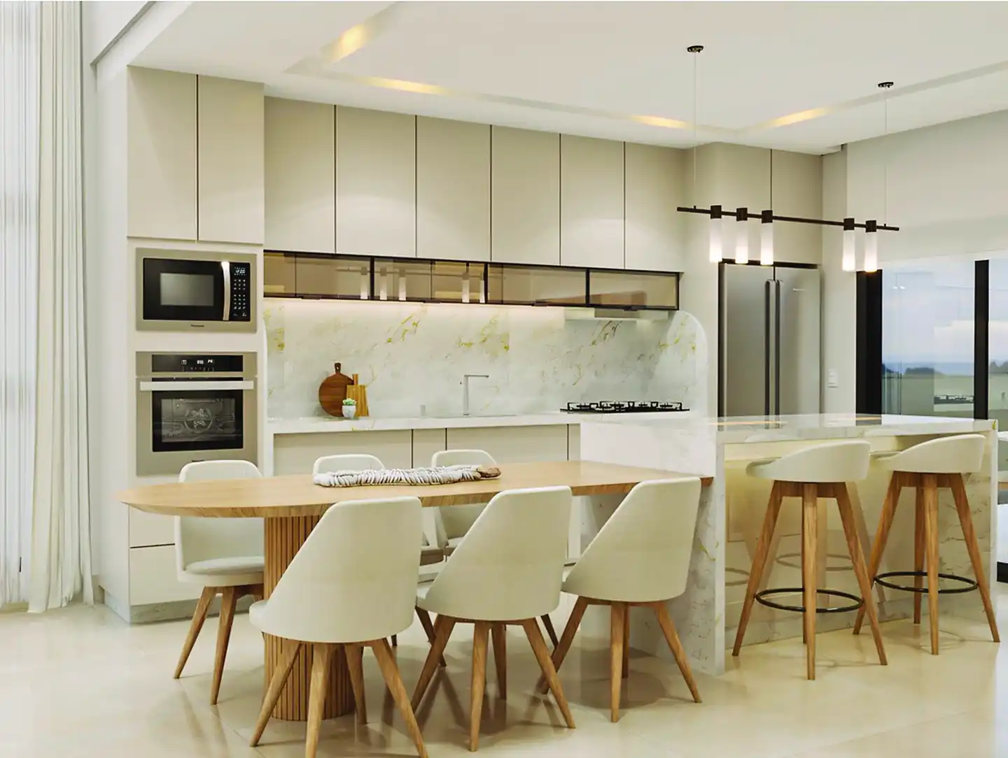 Cozinha da Casa Milão com mesa oval de madeira, armários claros e banquetas