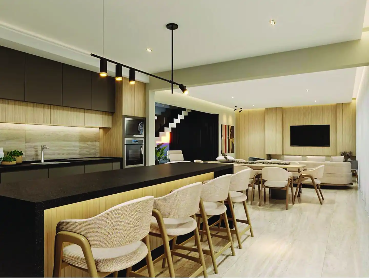 Cozinha com ilha escura, bancada clara e banquetas, integrada à sala
